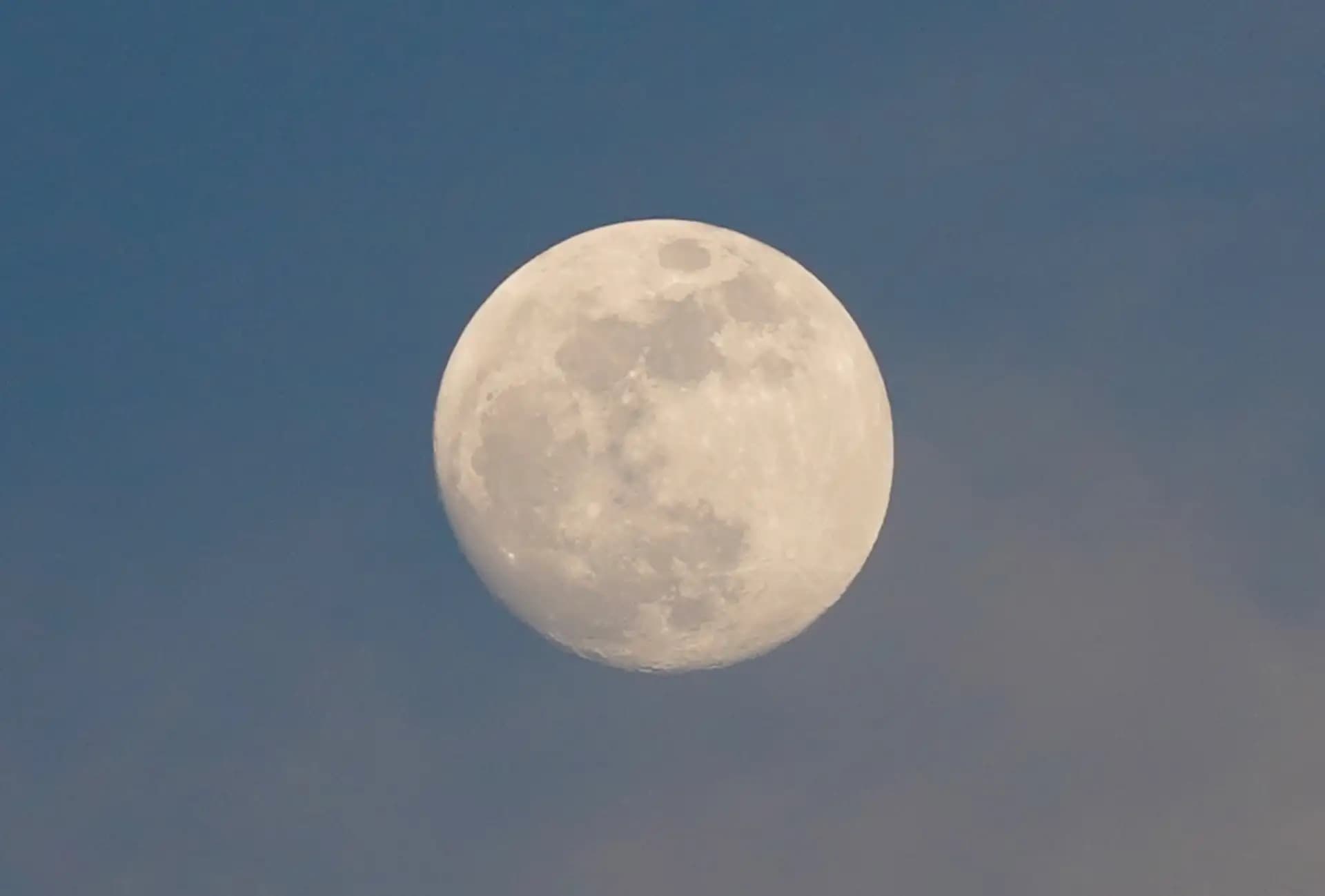 It was a full moon. The moon was lookng beautiful at the evening sky with clouds.