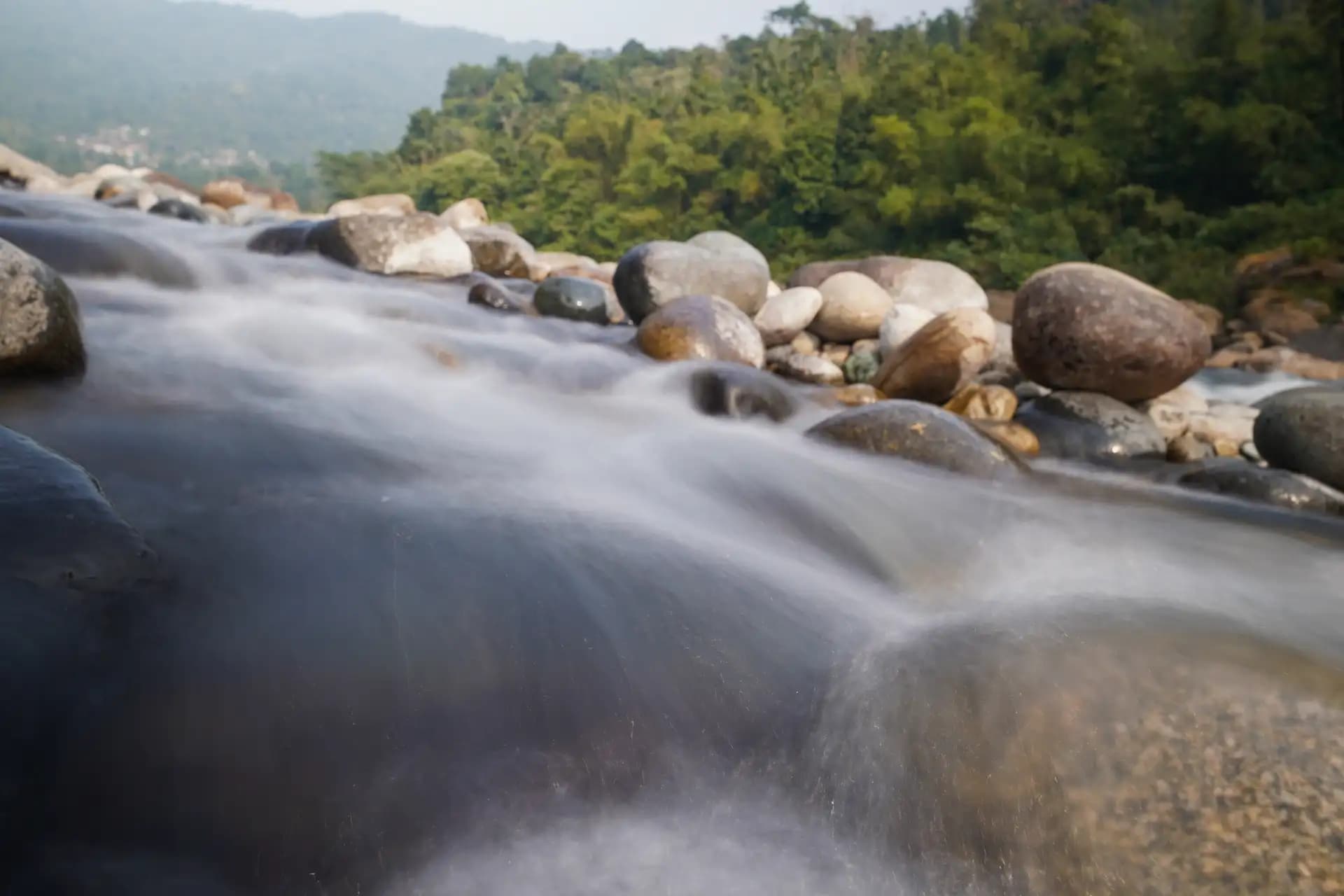 The flowing water in the Dawki river.